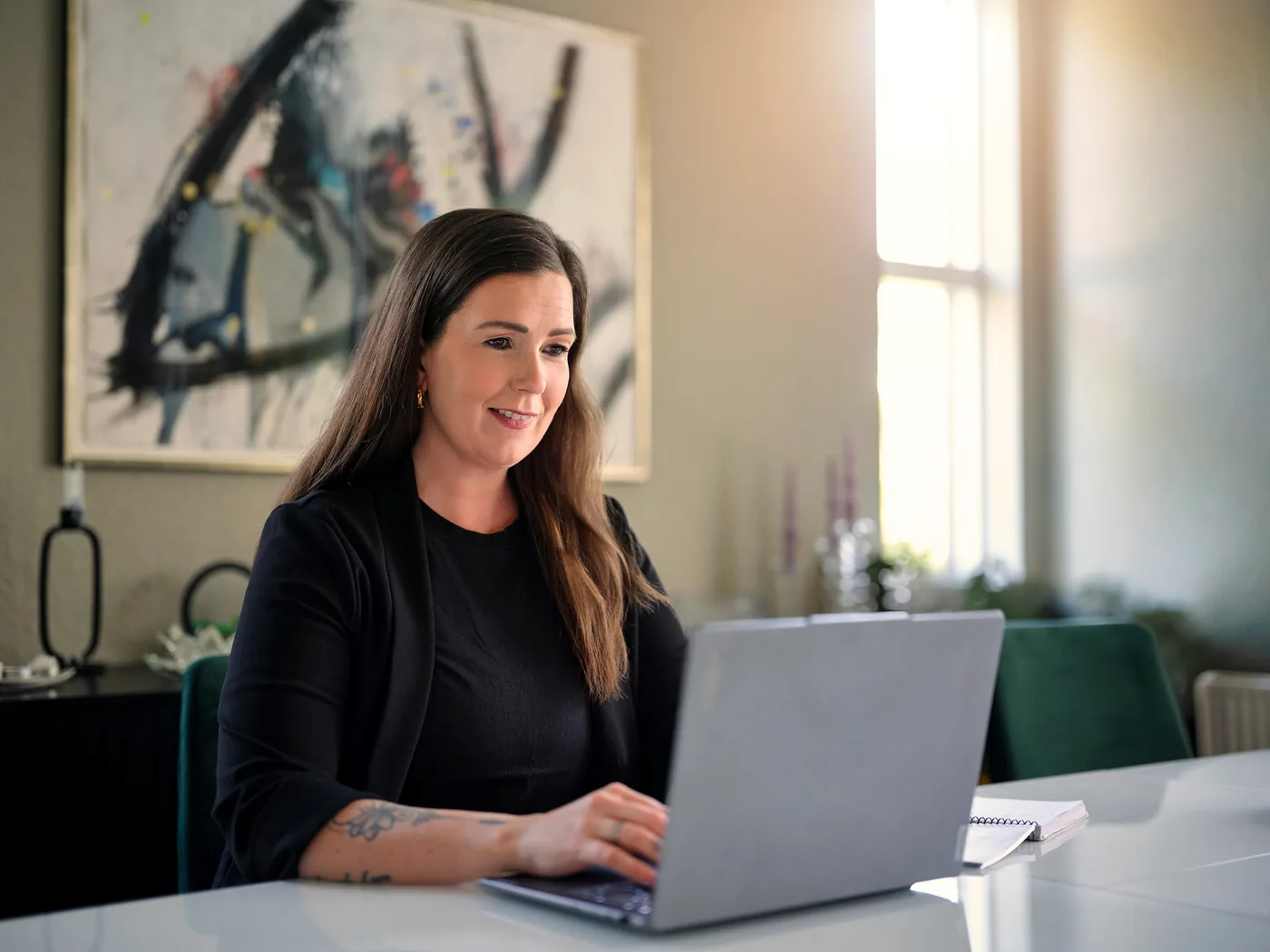 Maríanna working at her desk